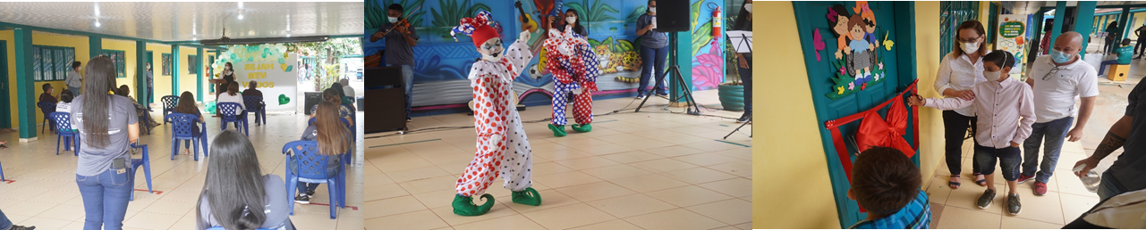 Women, children, and two people dressed as clowns performing to the public at the inauguration of the interactive rooms aimed at children with disabilities.