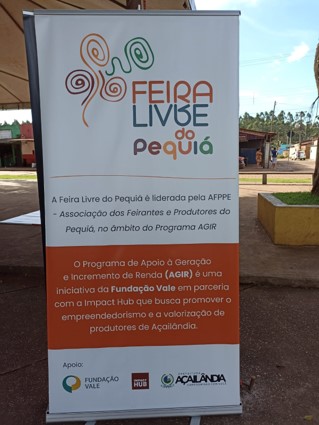 Imagem de um cartaz com informações sobre a Feira Livre do Pequiá. 